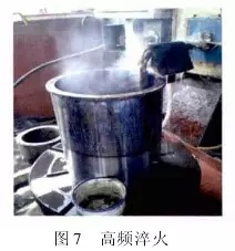 1 引言  山東魯碧建材有限公司2號輥磨為德國進口萊歇磨，主要用于生產礦渣微粉，減速機采用弗蘭德品牌，型號為：KMPP651，其結構為一級傘齒加兩級行星傳動。2013年3月9日，該減速機因功率過高報警，而且潤滑系統回油溫度急劇升高，晚上23：25減速機潤滑站過濾器壓差高報警，整個系統跳停。檢查過濾器濾網時發現有大量的黃色銅屑，經化驗銅屑成分為CuAl10Ni查閱設備圖紙推測該合金來自二級行星輪中的銅瓦。經過咨詢，弗蘭德專家給出了同樣的判斷，并提供了具體的解決方案。隨后， 山東魯碧建材有限公司按照弗蘭德公司出具的方案對該減速機進行了搶修。目前該減速機運行接近兩個月且效果良好?，F將具體原因、修復方案及預防措施簡單描述。  2 原因分析  該減速機自2008年2月份開始使用，到現在已運轉5年多，運轉率接近90%，因此設備或多或少存在老化問題，尤其是里面的合金瓦，由于自身硬度較低，一旦潤滑不良很容易造成損傷。在拆檢減速機時發現二級行星有一個行星輪堆積了大量的合金，且無法轉動，證明我們的判斷正確。在對該行星輪拆檢中發現了以下三個問題：（1）兩側的推力瓦嚴重燒蝕熔化（圖1）；（2）銅瓦處存積了大量油泥并將潤滑油道堵塞，而且銅瓦整個開裂、軸向延展接近30mm（圖2）；（3）銷軸局部裂紋（圖3）。    根據以上損壞分析，銅瓦潤滑油孔堵塞之后，造成銅瓦急劇升溫，溫度升高到一定程度使得銅瓦受熱開裂并且膨脹延展，最終與兩側的推力瓦接觸，推力瓦受到擠壓以后迅速升溫最終燒蝕，銷軸因此承受較大的扭矩及高溫，造成裂紋。  3 處理方案  推力瓦、銅瓦、銷軸的方案為按照尺寸重新制作備件。但在檢測齒輪時發現其內孔圓柱度較差以至于變成橢圓，而且表面硬度下降，遠遠低于圖紙要求（HRC55+5）。我們聯系弗蘭德公司欲購買該齒輪，對方回復該齒輪需要德國進口，加工周期為6個月，而且為保證齒輪嚙合，建議6個齒輪一起更換。此時， 山東魯碧建材有限公司銷售正處于旺季，該輥磨每天生產3000t微粉，停機6個月對我們的損失可想而知。我們聯系弗蘭德總部專家要求給出整改方案。對方經過詳細計算給出如下方案：擴大齒輪內孔直徑，再加一個過渡套，從而保證齒輪的硬度及裝配要求（圖5）。    3.1 過渡套材料選擇 過渡套材料采用42CrMo。該材料強度、淬透性高，韌性好，淬火時變形小，高溫時有高的蠕變強度和持久強度，用于制造要求強度更高和調質截面更大的鍛件。  3.2 處理工藝    （1）鍛打：目的是減小殘留夾雜物的尺寸，使其成分趨于均勻，組織趨于致密，細化晶粒，改善鋼的性能。    （2）粗車：單邊留4mm加工余量。    （3）著色探傷：目的是檢查工件是否有損傷，從而保證下一道工序順利進行。    （4）完全退火：目的是使工件的內部組織全部進行重結晶，通過完全退火來細化晶粒，均勻組織，消除內應力，同時降低硬度，便于切削加工，并為加工后零件的淬火作好組織準備（圖6）。    具體過程：零件在爐溫>800℃裝爐，立即通入甲醇：50~60ml/min、氮氣：4~6m3/h；溫度升到850℃之后甲醇：35~45ml/min、氮氣：4m3/h；保溫120min后隨爐冷降溫至650℃，停甲醇，氮氣：5m3/h；降溫至550℃時出爐空冷。    （5）半精車：單邊0.75mm，從而滿足下一步淬火的淬硬層>0.5mm的要求。    （6）高頻淬火（圖7）：該套由于工作面是套的內孔及兩個端面，硬度要求HRC58-62，淬硬層>0.5mm。因此，選擇高頻淬火，這樣既能局部熱處理，同時也滿足硬度要求。另外，高頻淬火時工件的冷卻至關重要，為保險起見采用淬火液進行冷卻；感應器距離工件的位置也非常重要，離得太近容易造成感應器受熱，堵塞冷卻水溢流孔，離得太遠影響熱功率的傳遞，一般控制在3~5mm。       （7）精車外圓及內孔：外圓最終尺寸為?330t6，內孔最終尺寸為?330H6，這樣保證外圓與齒輪內孔過盈配合，過盈量控制在0.2~0.3mm；內孔與銅套間隙配合，間隙控制在0.1~0.12mm。    （8）精車端面：將過渡套與齒輪進行冷裝之后，對過渡套的端面進行精車，要求兩個端面與內孔垂直度，圓跳度誤差控制在0.02mm以內。 目前，該減速機已恢復生產兩個月，二級行星振動值3~5mm/s，輥壓9.0MPa，比表面積440m2/kg，磨機產量也逐漸恢復到150t/h，運轉狀況良好。  4 采取的措施  4.1 加強設備巡檢并采用先進的檢測工具 該減速機恢復生產之后，我們加強了巡檢力度，購買了先進的在線巡檢儀，它不僅能對減速機振動進行檢測形成趨勢圖，而且還能進行數據傳輸及保存，這樣我們就能夠通過趨勢圖來推斷減速機運行狀況。  4.2 加強油品檢測 目前，我們每個月都要對潤滑油進行檢測，項目有粘度、機械雜質、水分、污染等級等，通過對油樣的檢測，可以隨時掌握減速機內部運轉狀況，保證了潤滑的可靠性。  4.3 提高磨機操作水平 喂料粒度控制在80mm以內，這樣既能保證碾磨料層厚度避免磨機振動，又能提高研磨效率；另外，加強選粉機轉速、喂料量、熱風控制的調整，從而保證磨機穩定順行。  4.4 選用材質較好的濾芯 弗蘭德KMPP651減速機內部全部為滑動軸承，對潤滑油的潔凈度要求比較高，一旦有異物進入很容易造成油道堵塞。因此，濾芯的選用至關重要，我們現在選用的是力士樂25μm濾芯，使用效果很好。  5 結語  輥磨的穩定運行對減速機的使用壽命至關重要，減少輥磨運行的振動值，有利于減速機提高使用壽命；另外，定期檢測減速機各個軸瓦部位的振動，并且定期對潤滑油進行檢測及檢查過濾網上有無雜質，對提高減速機的穩定順行也至關重要。